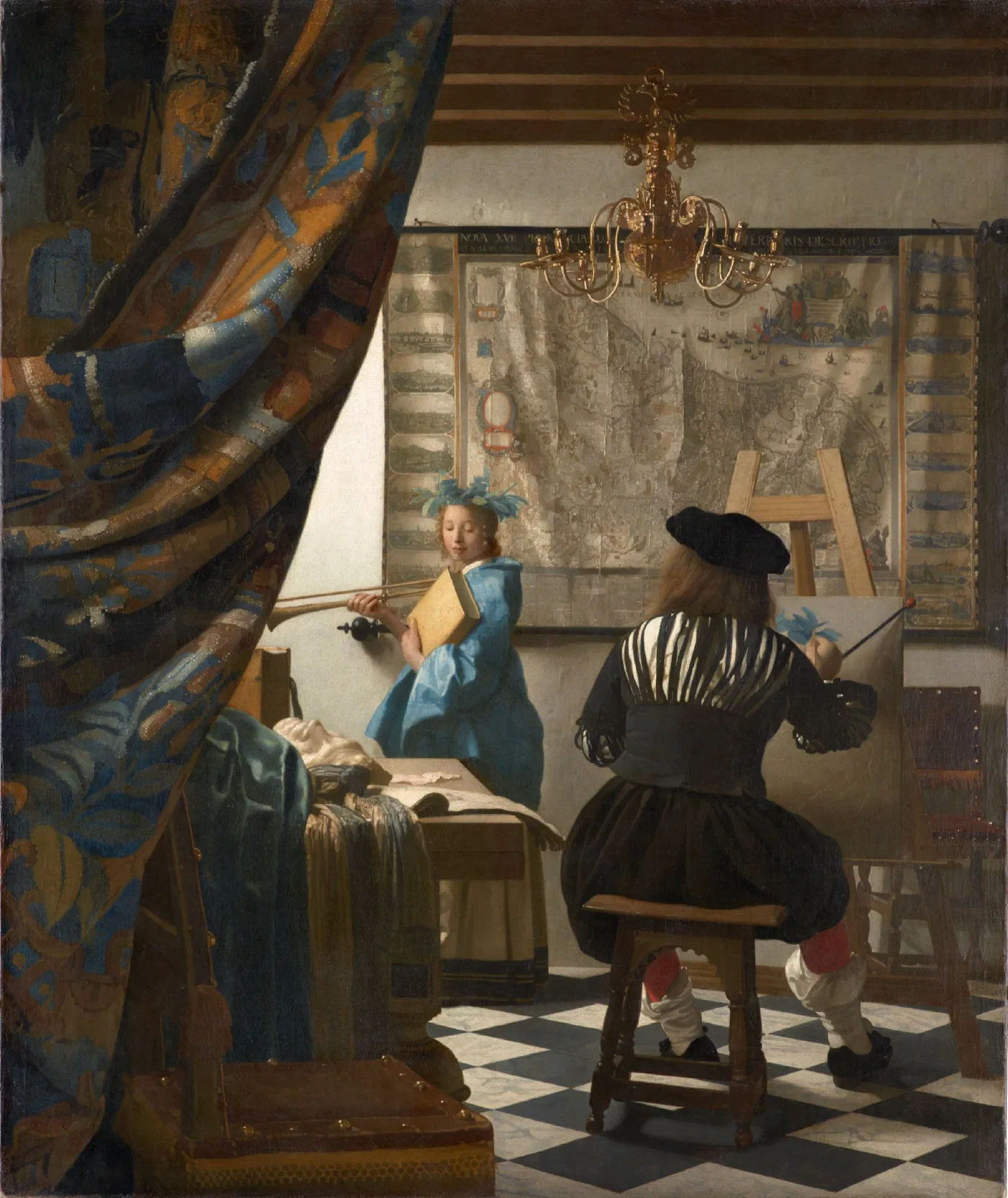The Art of Painting by Johannes Vermeer (c. 1666–1668), a painter seen from behind at his easel, painting a young woman in blue who poses by the window in front of a large map.