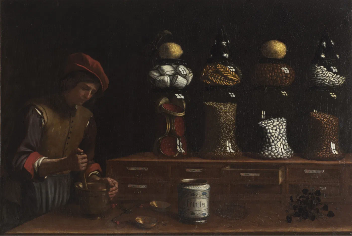 The Spice Shop by Paolo Antonio Barbieri (1637), a young shopkeeper grinding with a mortar beside a counter of labelled drawers and jars of spices stacked two high.